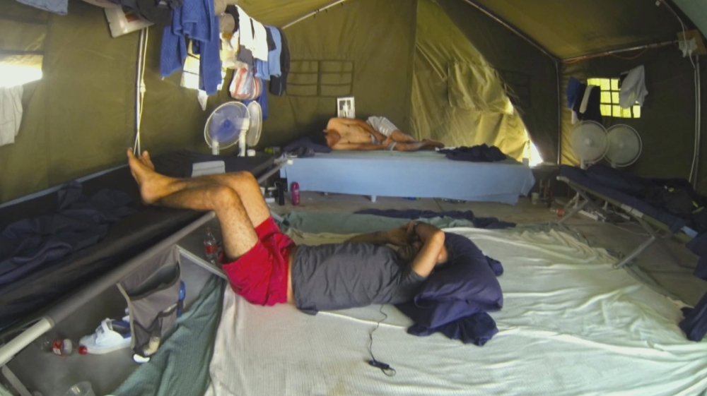 Asylum seekers in a tent at the Nauru offshore detention centre. The Australian government has received widespread condemnation for the appaling living conditions in its Manus and Nauru 'processing centres' [Screengrab/Al Jazeera]