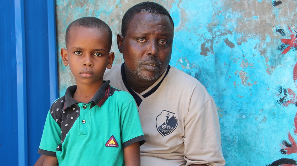 Abdiaziz, right, and the youngest son of his brother Ahmed, who is missing after the blast [Nuur Mohamed/Al Jazeera]