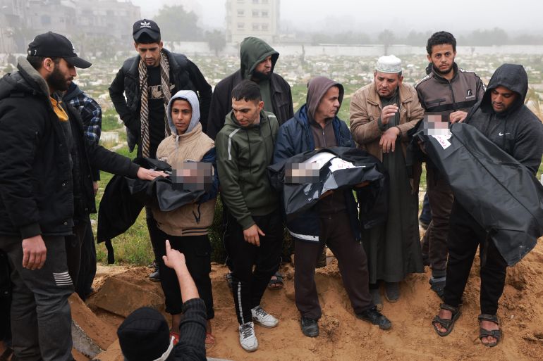 Mourners carry the bodies of Palestinian children Zein and Watin Saleh as well as the child Motaz Al-Mashukhi, killed in Israeli bombardment in Rafah in the southern Gaza strip