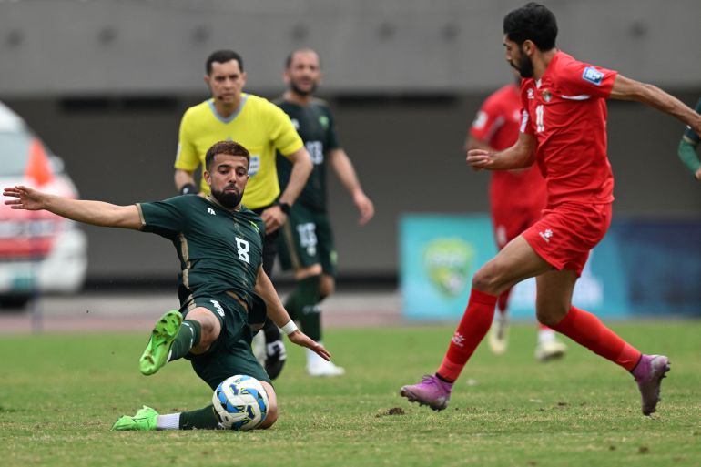 Pakistan's Rahis Nabi (L) and Jordan's Yazan Alnamat (R) fight for the ball during the 2026 FIFA World Cup qualifier football match between Pakistan and Jordan at the Jinnah Sports stadium in Islamabad on March 21, 2024. (Photo by Aamir QURESHI / AFP)