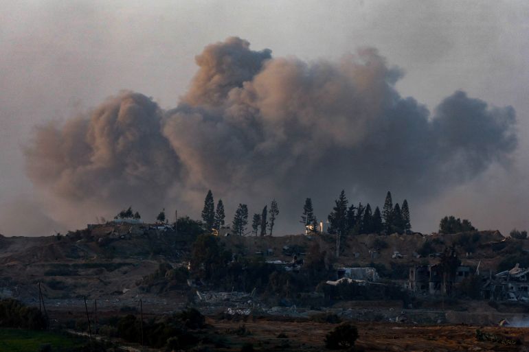 Smoke rises during an explosion in central Gaza in January 2024