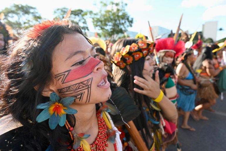 Brazilian indigenous from the Pataxo ethnic group march in Brasilia as part of the Acampamento Terra Livre (Free Land Camp)