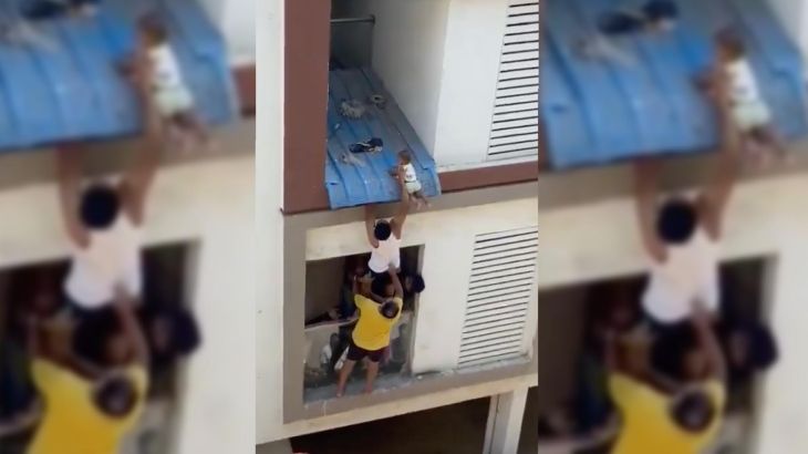 Baby rescued from apartment roof’s edge in India