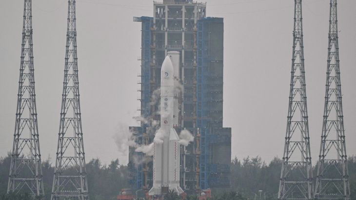 This picture shows a Long March 5 rocket, carrying the Chang'e-6 mission lunar probe, at the Wenchang Space Launch Centre in southern China's Hainan Province on May 3, 2024. China is set on May 3 to launch a probe to collect samples from the far side of the Moon, a world first as Beijing pushes ahead with an ambitious programme that aims to send a crewed lunar mission by 2030. (Photo by HECTOR RETAMAL / AFP)